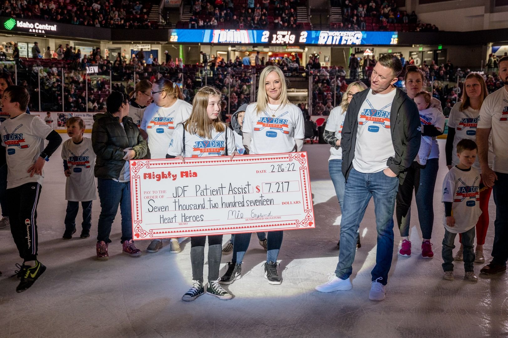 Mia Englund presents large check to JDF Patient Assistance fund after receiving numerous donations for her birthday.